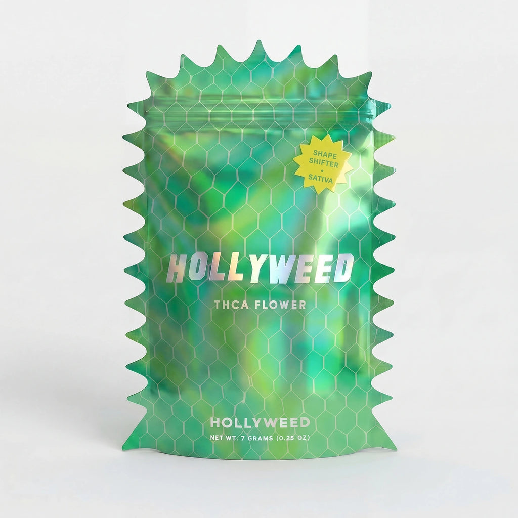 Hollyweed THCA Flower Shape Shifter Sativa in 7g mylar bag showing vibrant green buds and orange pistils.