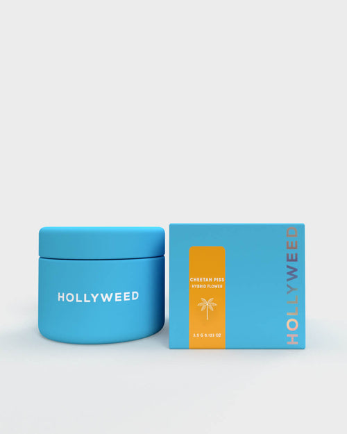 Hollyweed THCA Flower Cheetah Piss hybrid strain in a jar and box with vibrant green buds and orange pistils.