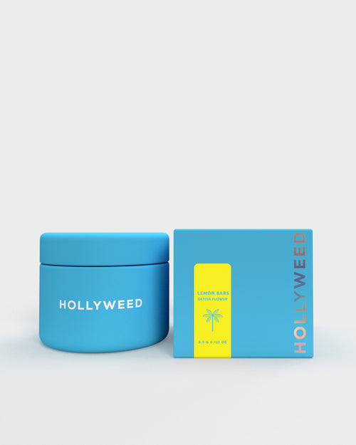 Hollyweed Lemon Bars THCA flower in a jar and box, showcasing bright yellow sativa cannabis buds with citrus aroma.